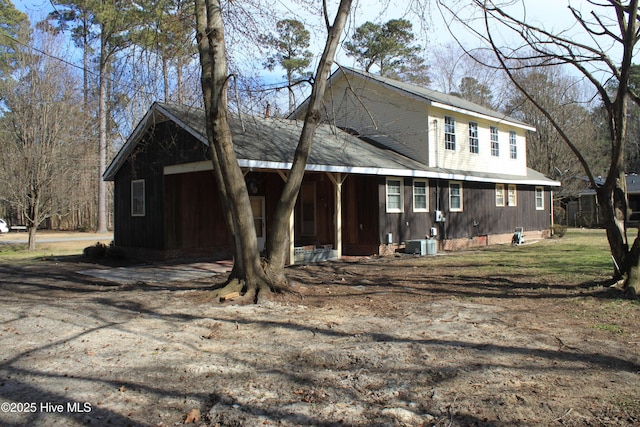 view of front of home with covered porch and central AC unit