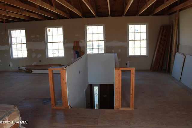 interior space with a wealth of natural light and an upstairs landing