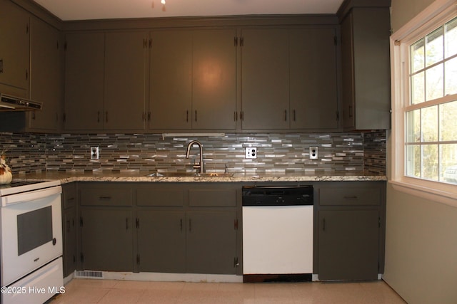 kitchen featuring gray cabinets, white appliances, a sink, and decorative backsplash