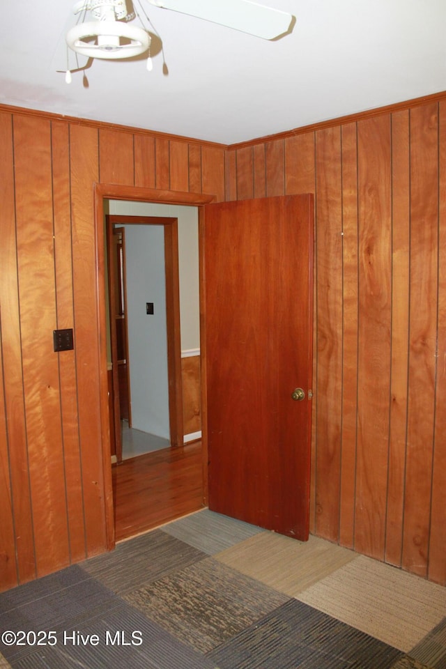 spare room with wooden walls