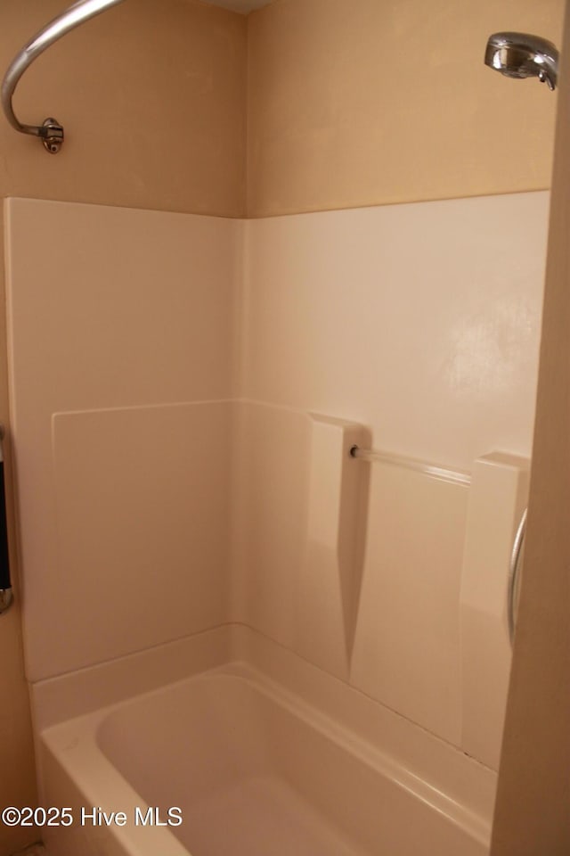 bathroom with shower / tub combination