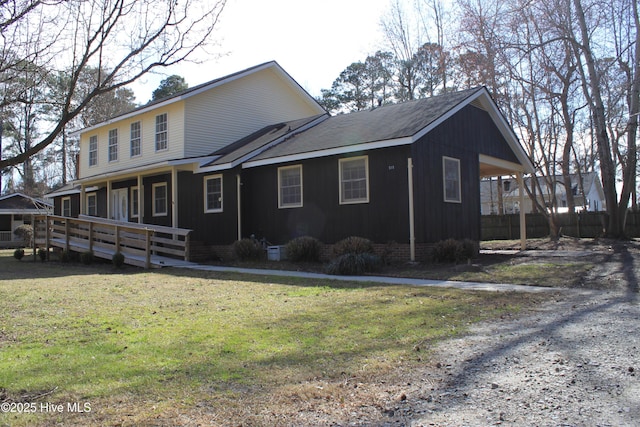 view of side of home featuring a lawn