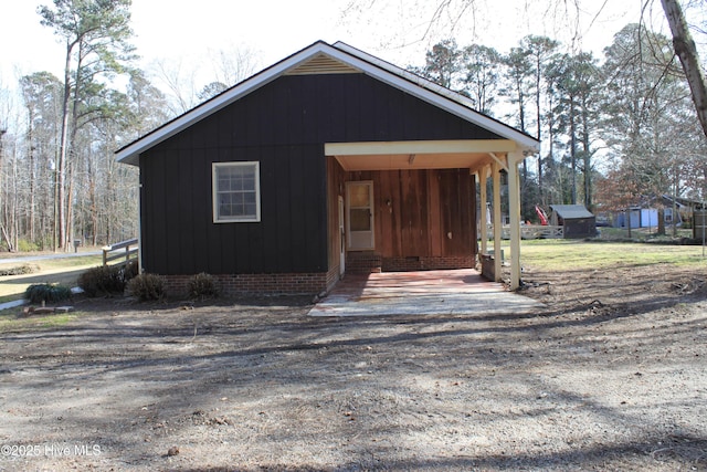 view of front of home with board and batten siding and crawl space