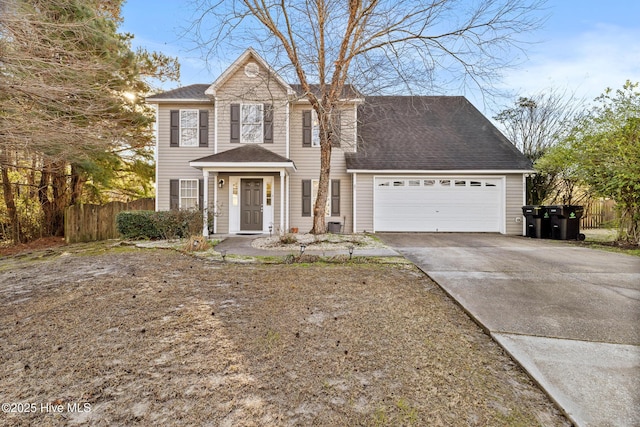 view of front of home with fence, a garage, driveway, and roof with shingles