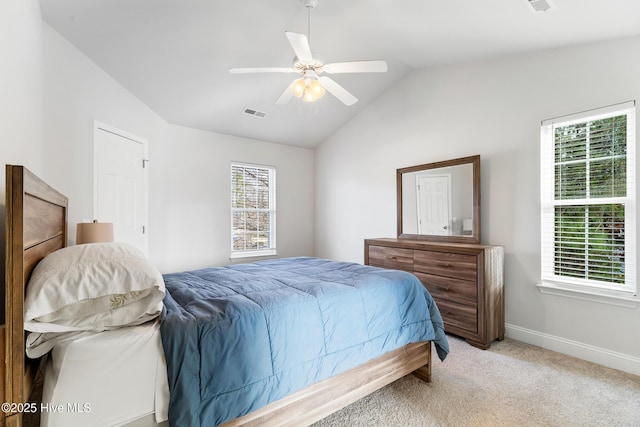 bedroom with visible vents, baseboards, ceiling fan, light colored carpet, and lofted ceiling