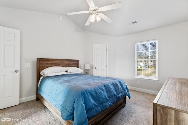 bedroom with baseboards, visible vents, carpet floors, and lofted ceiling