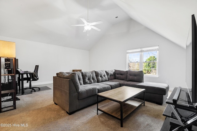 carpeted living area featuring vaulted ceiling, baseboards, and ceiling fan