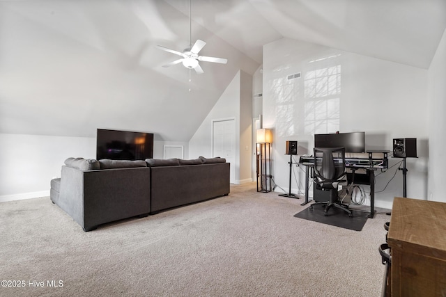 carpeted office space with visible vents, a ceiling fan, baseboards, and high vaulted ceiling