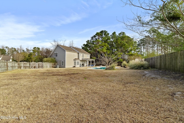 view of yard featuring a patio and a fenced backyard