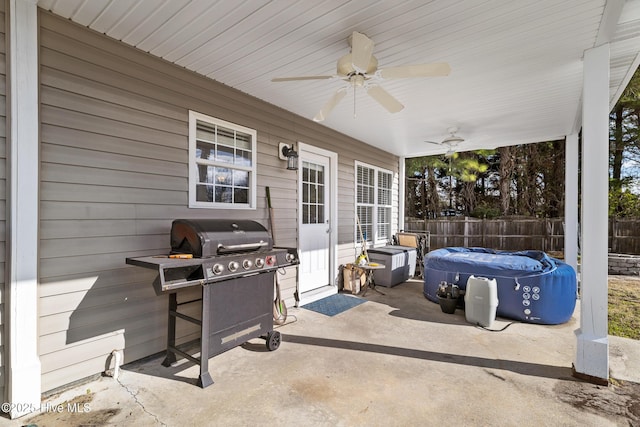 view of patio / terrace featuring grilling area, ceiling fan, and fence