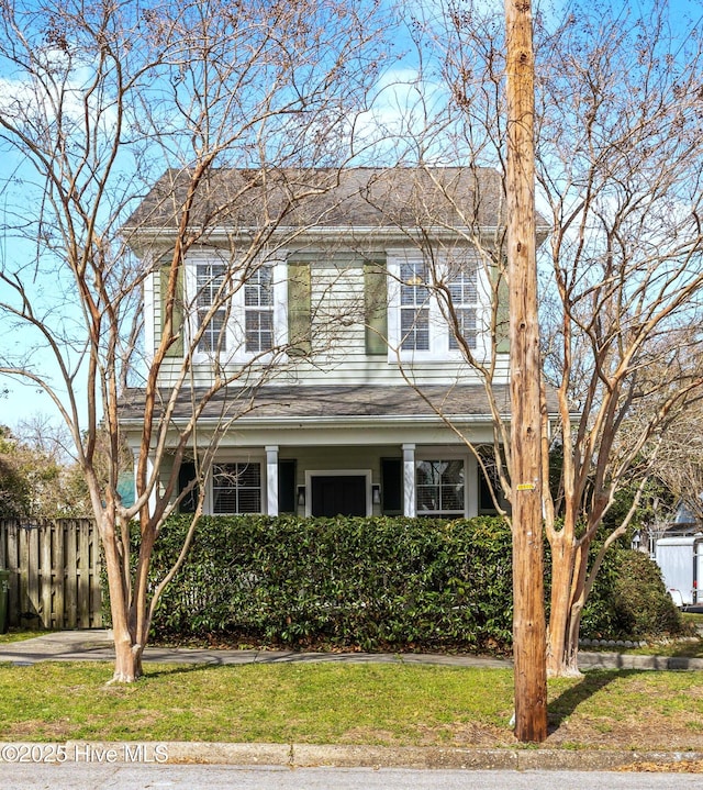 view of front of property featuring fence