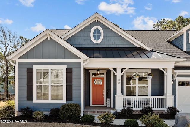 view of front of home with a porch, a shingled roof, and an attached garage