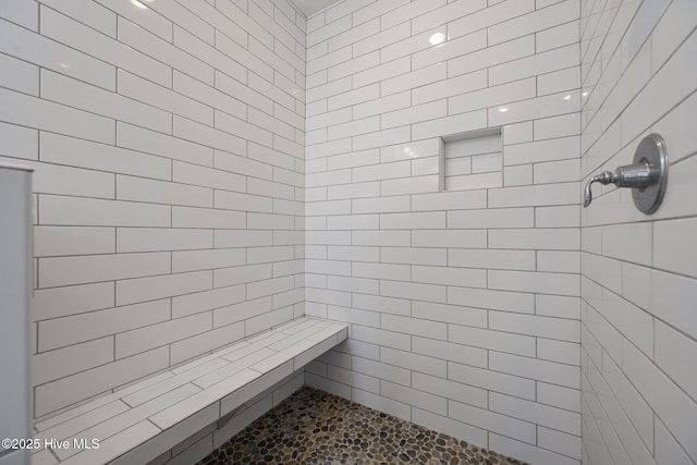 full bathroom with a tile shower