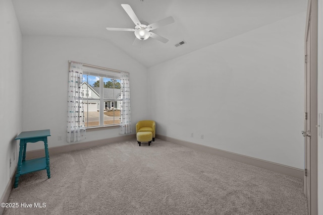 sitting room with visible vents, ceiling fan, baseboards, lofted ceiling, and carpet flooring