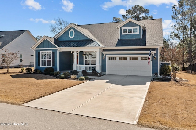 craftsman house with driveway, a standing seam roof, a porch, a shingled roof, and metal roof