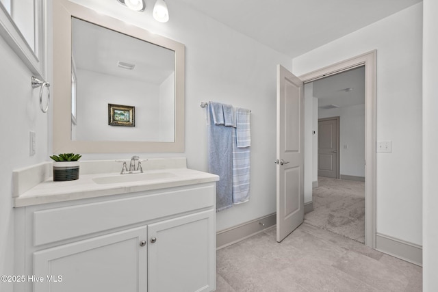 bathroom with baseboards and vanity