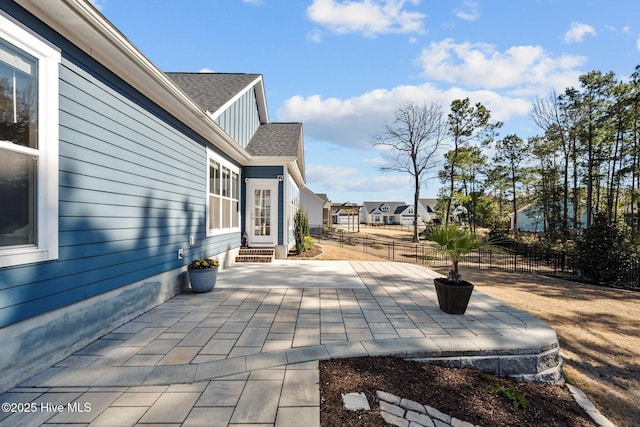 view of patio / terrace with entry steps and fence