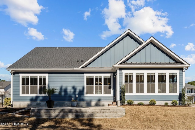 rear view of property with board and batten siding