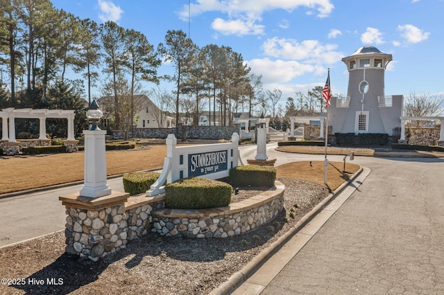 view of home's community featuring a pergola