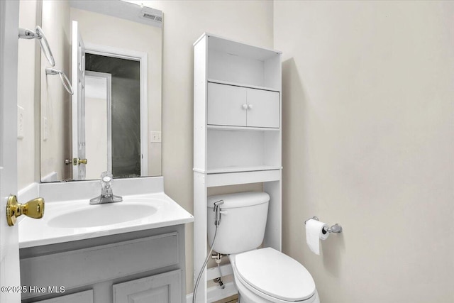 148 Mendover Dr, Jacksonville, NC 28546 - half bath featuring toilet, vanity, and baseboards