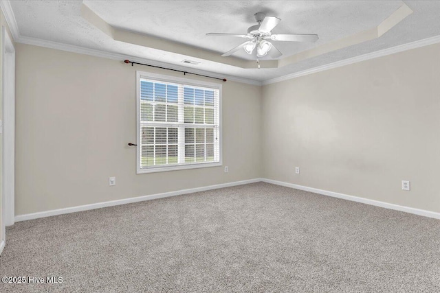 148 Mendover Dr, Jacksonville, NC 28546 - carpeted spare room with a tray ceiling, ceiling fan, a textured ceiling, baseboards, and ornamental molding