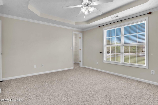 148 Mendover Dr, Jacksonville, NC 28546 - carpeted spare room with a raised ceiling, ceiling fan, baseboards, crown molding, and a textured ceiling