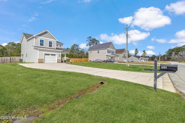 exterior space featuring concrete driveway, stone siding, an attached garage, fence, and a front yard