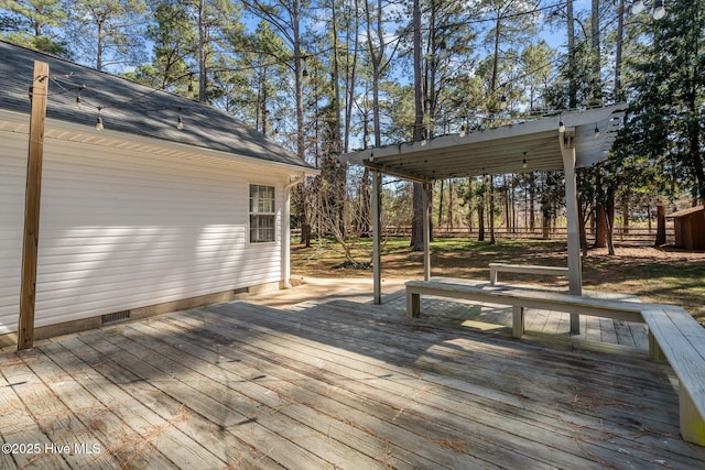 wooden deck featuring fence