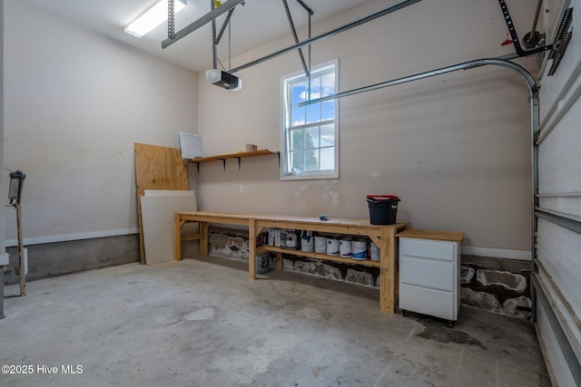 garage featuring a workshop area and a garage door opener