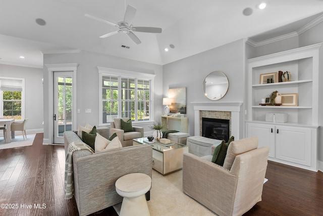 2900 Legends Dr, Southport, NC 28461 - living room featuring wood-type flooring, a glass covered fireplace, ceiling fan, recessed lighting, and vaulted ceiling