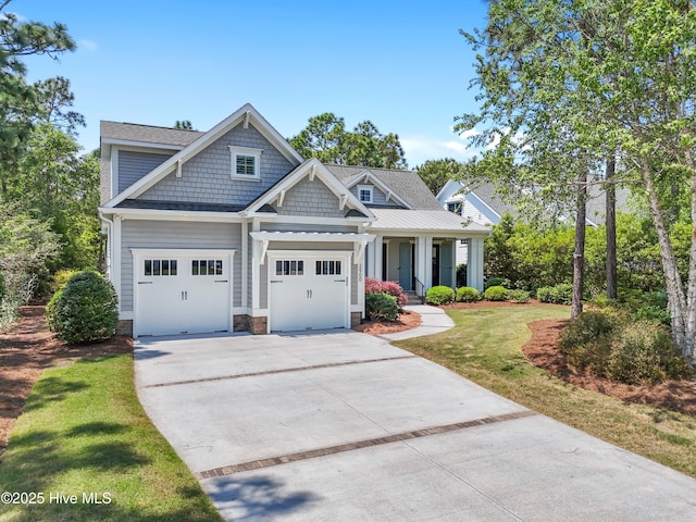 2900 Legends Dr, Southport, NC 28461 - craftsman inspired home with concrete driveway, a front lawn, a porch, and a shingled roof