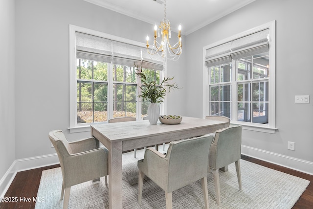 2900 Legends Dr, Southport, NC 28461 - dining room featuring a chandelier, dark wood finished floors, healthy amount of natural light, crown molding, and baseboards