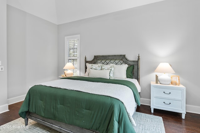 2900 Legends Dr, Southport, NC 28461 - bedroom with baseboards and wood finished floors