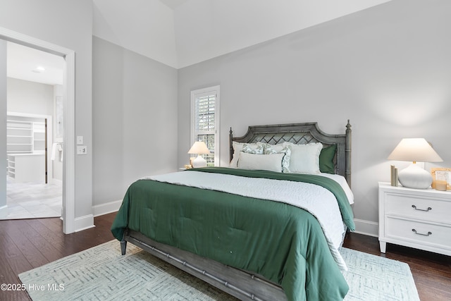 2900 Legends Dr, Southport, NC 28461 - bedroom featuring wood finished floors, baseboards, and high vaulted ceiling