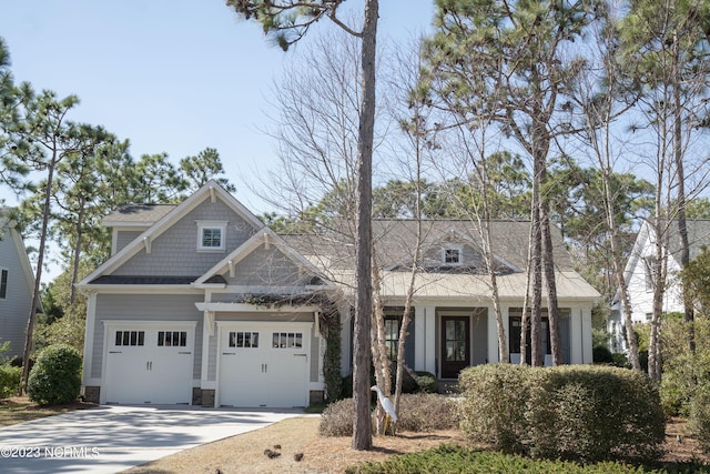 craftsman inspired home featuring concrete driveway