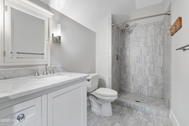 2900 Legends Dr, Southport, NC 28461 - bathroom featuring toilet, vanity, and a tile shower