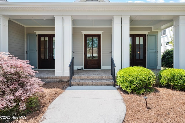 2900 Legends Dr, Southport, NC 28461 - doorway to property featuring covered porch