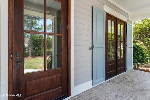 2900 Legends Dr, Southport, NC 28461 - doorway to property with a porch and french doors