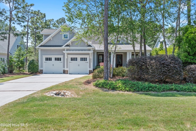 2900 Legends Dr, Southport, NC 28461 - view of front facade with concrete driveway, a front yard, and a garage