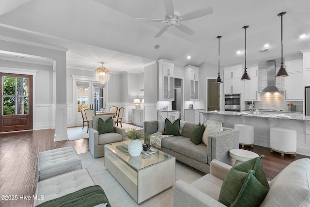 2900 Legends Dr, Southport, NC 28461 - living area with light wood-style floors, crown molding, wainscoting, recessed lighting, and ceiling fan