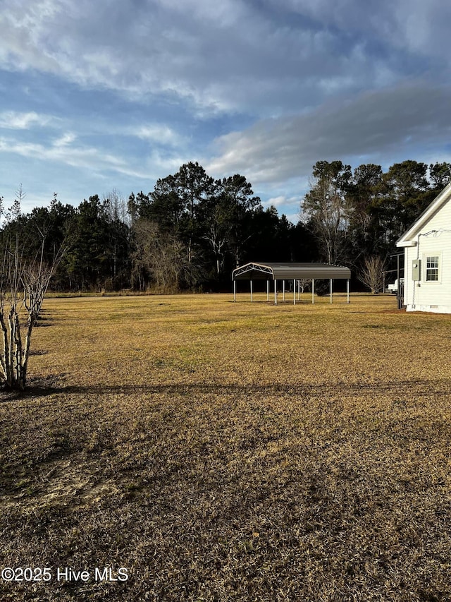 view of yard with a carport