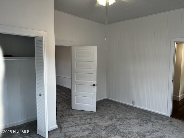 unfurnished bedroom featuring a closet and carpet flooring