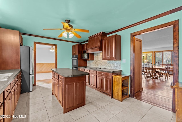 kitchen with light tile patterned floors, appliances with stainless steel finishes, crown molding, and ceiling fan