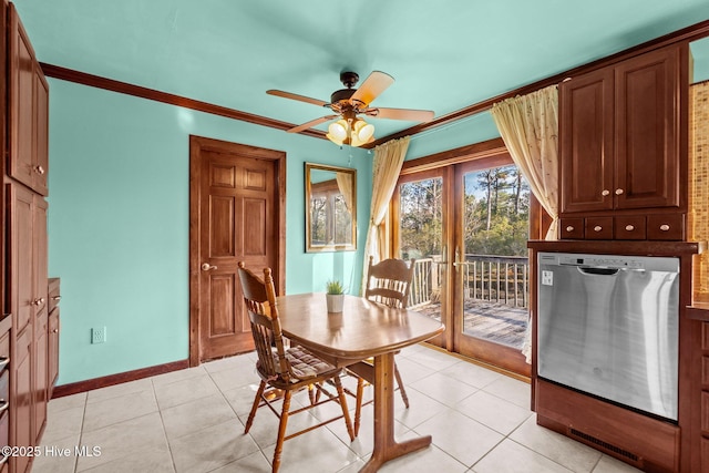 dining area featuring baseboards, light tile patterned flooring, a ceiling fan, and ornamental molding