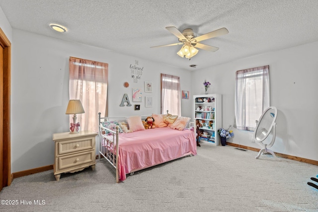 bedroom featuring multiple windows, carpet flooring, and baseboards