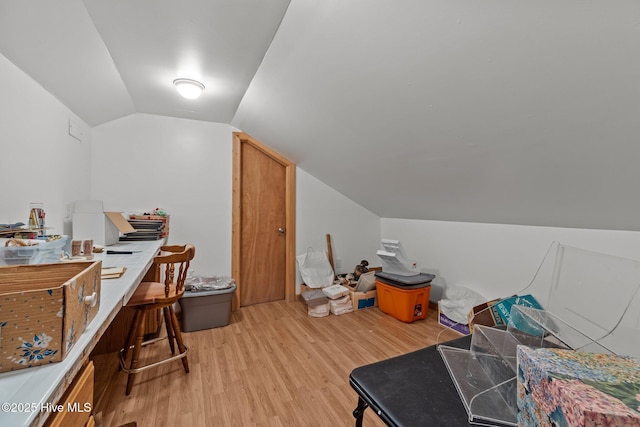 interior space with lofted ceiling and light wood finished floors