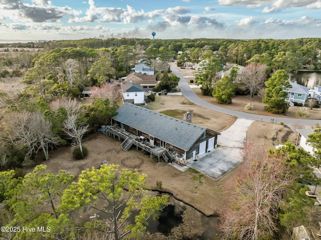 drone / aerial view featuring a view of trees