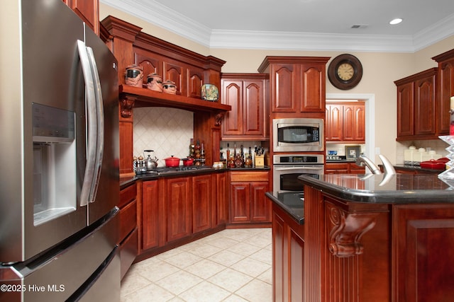906 Taberna Cir, New Bern, NC 28562 - kitchen with light tile patterned floors, ornamental molding, stainless steel appliances, dark countertops, and backsplash