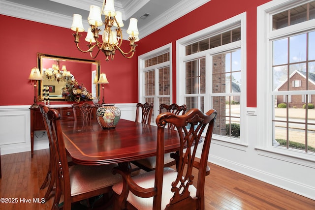 906 Taberna Cir, New Bern, NC 28562 - dining area with hardwood / wood-style floors, a wainscoted wall, a chandelier, and ornamental molding