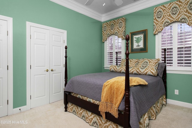 906 Taberna Cir, New Bern, NC 28562 - carpeted bedroom featuring a closet, ceiling fan, crown molding, and baseboards
